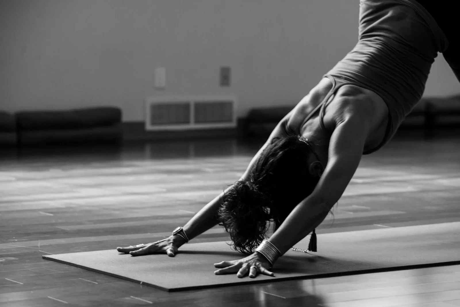 Downward dog on a mat in the studio